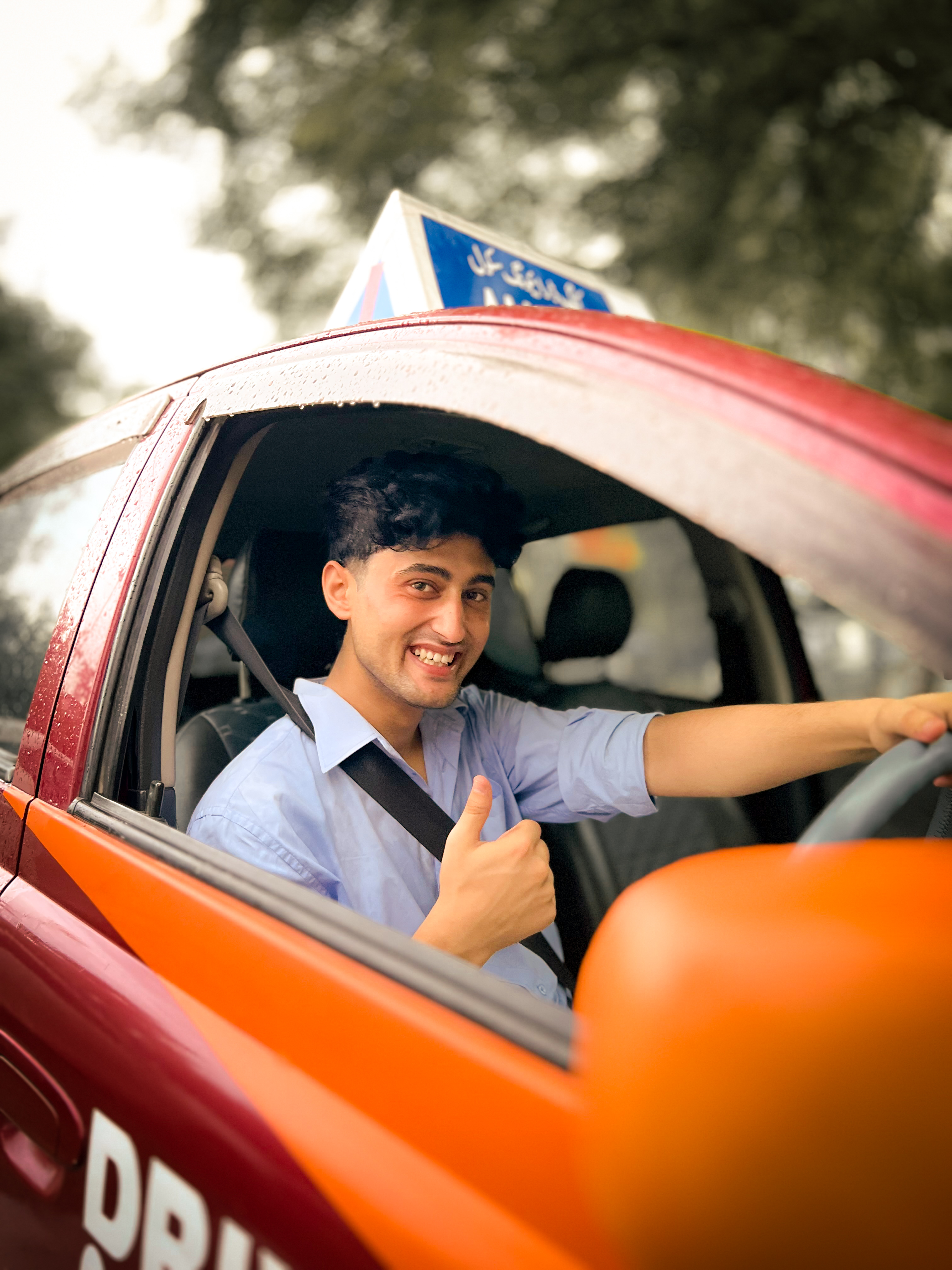 Satisfied King Driving School student with driving license